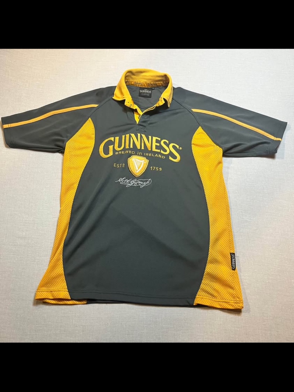 Guinness Dark Gray and Yellow Athletic Polo